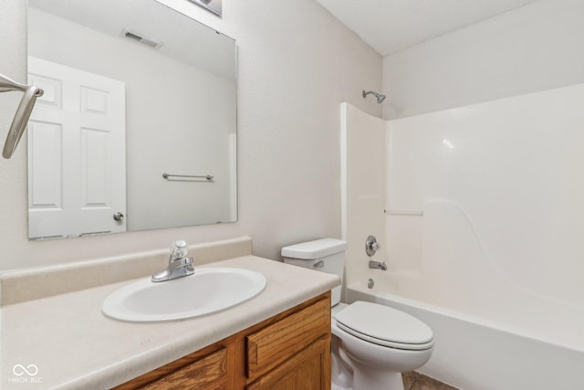 full bathroom with shower / bathtub combination, toilet, and vanity