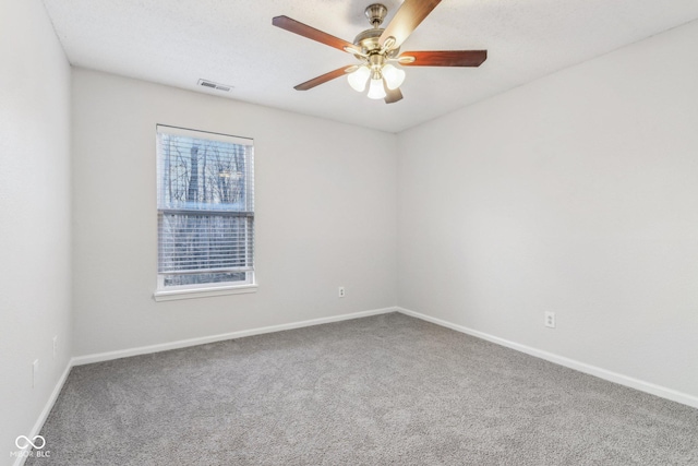 empty room with carpet floors and ceiling fan