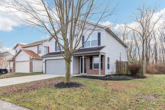 view of front property with a garage and a front yard