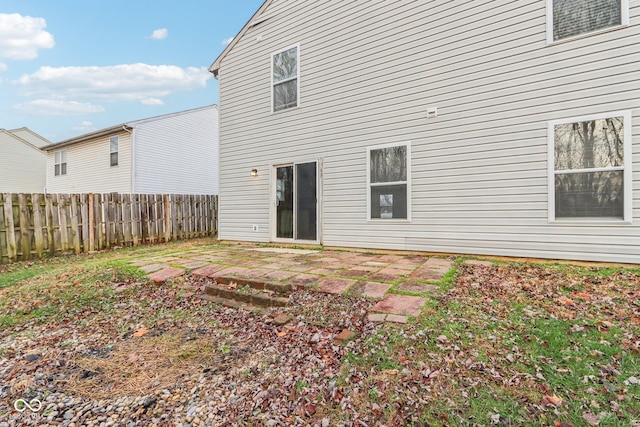 back of house with a patio