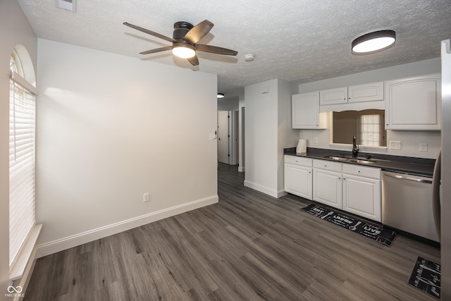 kitchen featuring sink, white cabinetry, dark hardwood / wood-style floors, dishwasher, and a healthy amount of sunlight