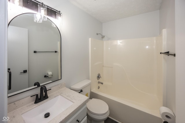 full bathroom featuring vanity, toilet, a textured ceiling, and shower / bath combination