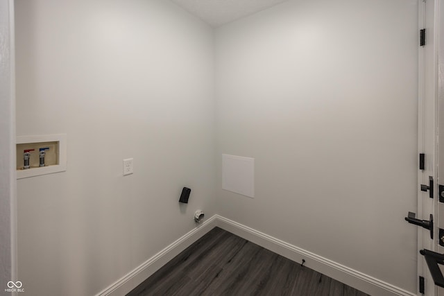 washroom with hookup for a washing machine and dark wood-type flooring