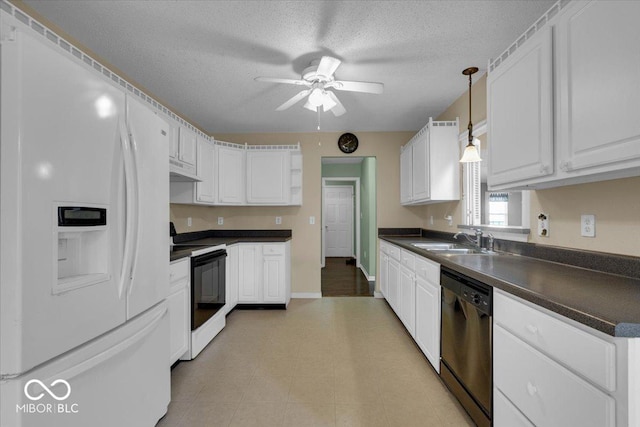 kitchen with pendant lighting, white cabinetry, white appliances, and sink