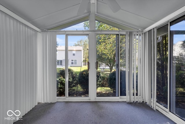 unfurnished sunroom with a healthy amount of sunlight and lofted ceiling