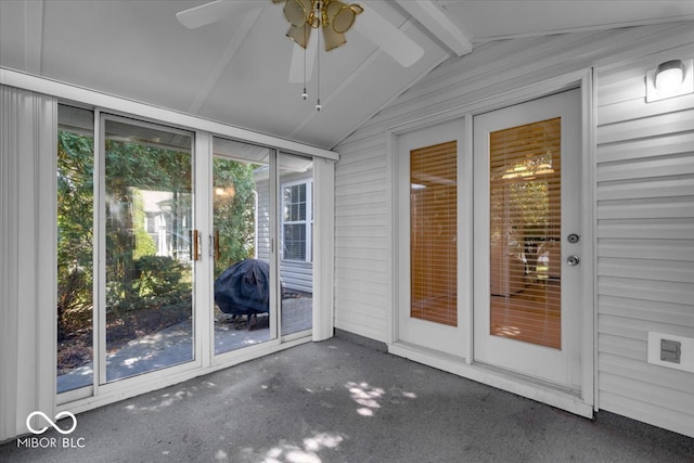 unfurnished sunroom featuring vaulted ceiling with beams and ceiling fan