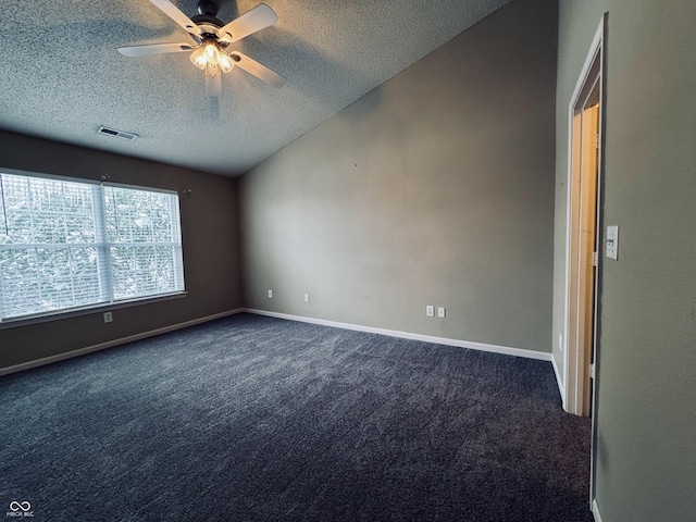 carpeted empty room featuring ceiling fan, a textured ceiling, and vaulted ceiling