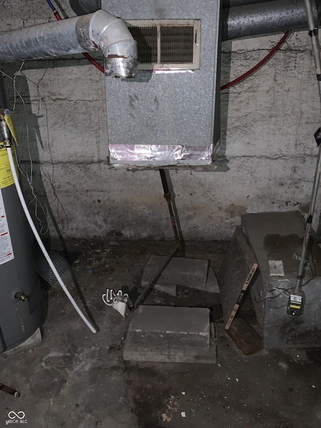 utility room featuring gas water heater