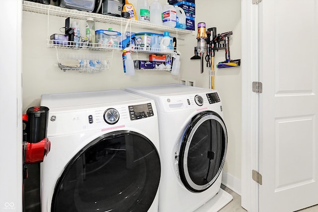 laundry room with washing machine and dryer