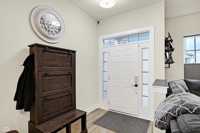 foyer with light hardwood / wood-style floors