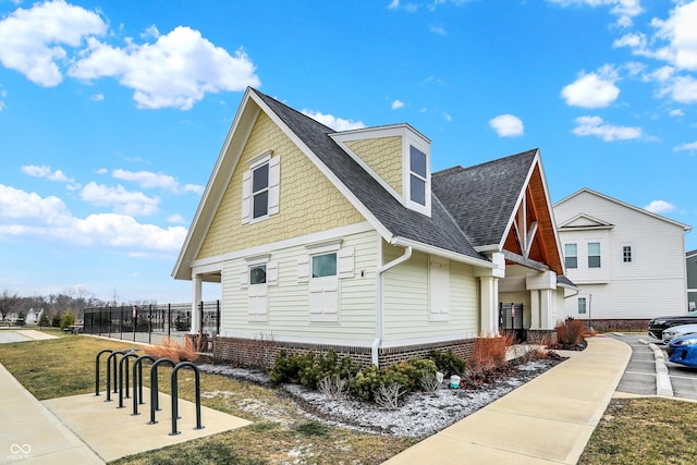 view of property exterior featuring a lawn