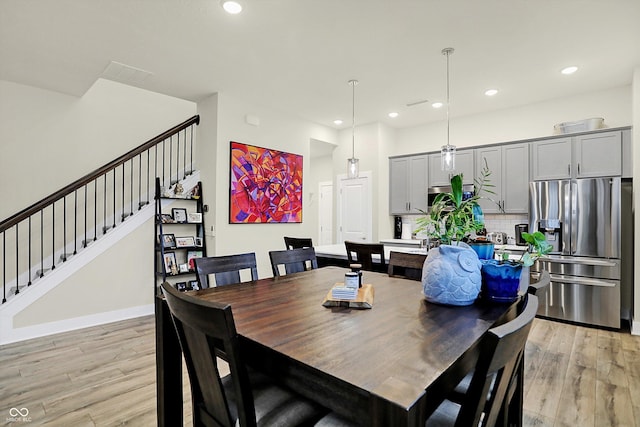 dining space featuring light hardwood / wood-style flooring