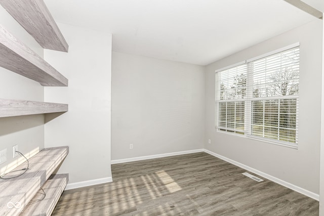 unfurnished dining area featuring dark hardwood / wood-style floors