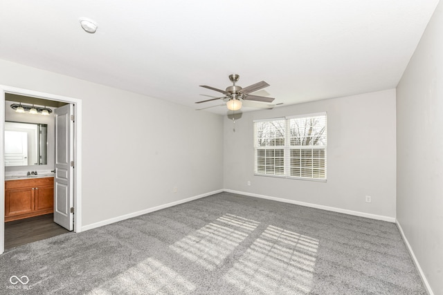 carpeted empty room with ceiling fan and sink