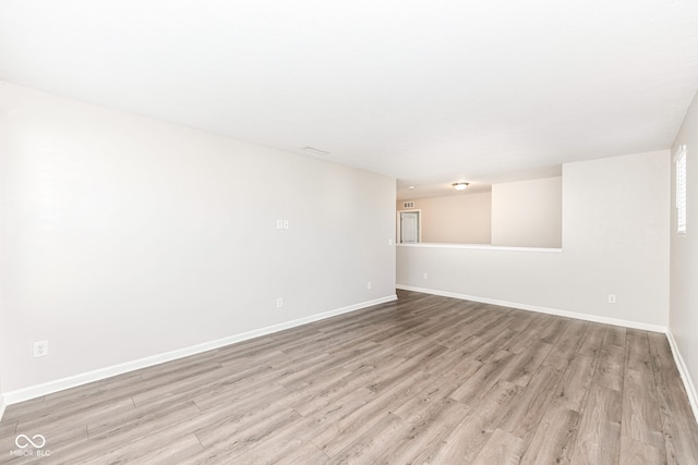 unfurnished room with light hardwood / wood-style flooring