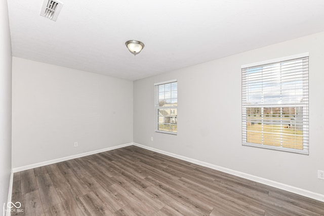 empty room featuring dark hardwood / wood-style floors