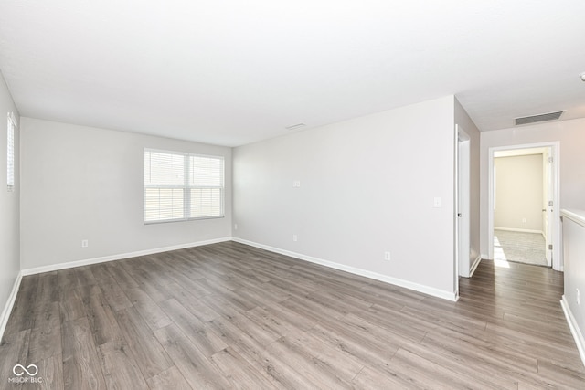 spare room with light wood-type flooring