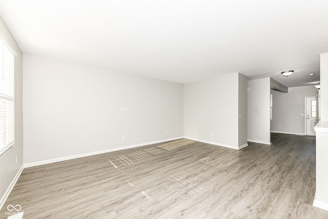 empty room with hardwood / wood-style flooring