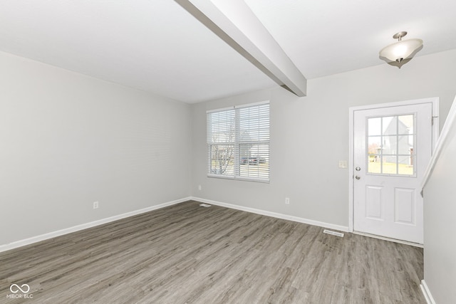 6927 Park Grove Blvd, Whitestown, IN 46075 - entryway with healthy amount of natural light, wood finished floors, and beamed ceiling