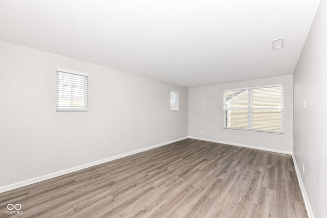 spare room featuring light hardwood / wood-style floors