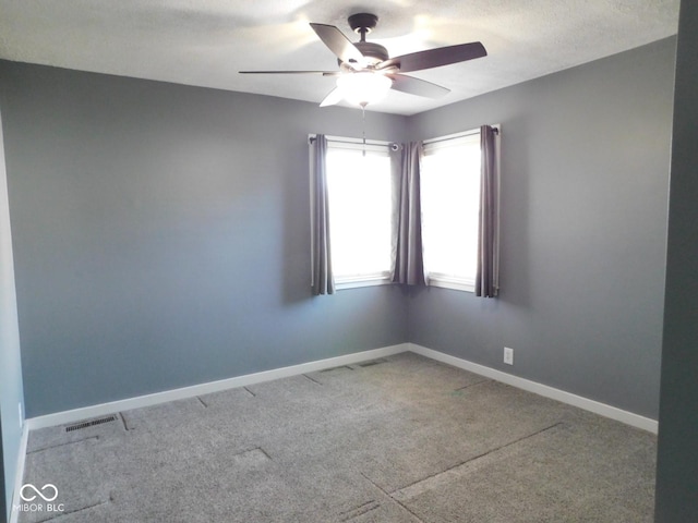 empty room with carpet and ceiling fan