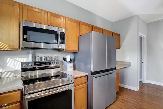 kitchen with light wood-type flooring and stainless steel appliances