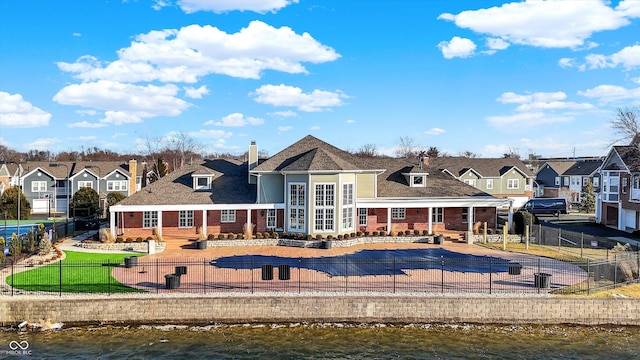 rear view of house with a water view