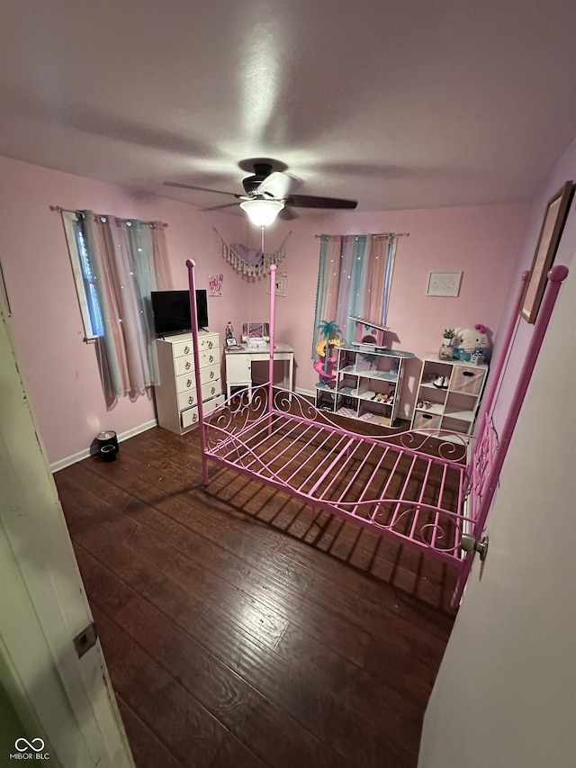 interior space with dark hardwood / wood-style floors and ceiling fan