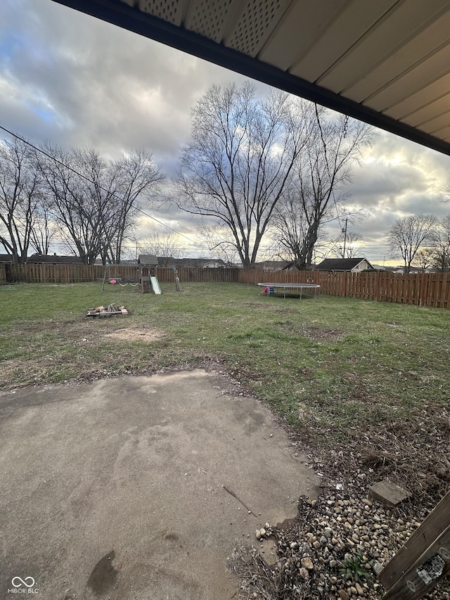 view of yard with a trampoline