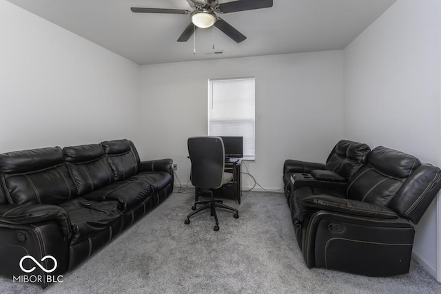 carpeted office featuring ceiling fan