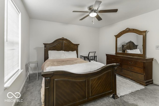 bedroom with light colored carpet and ceiling fan