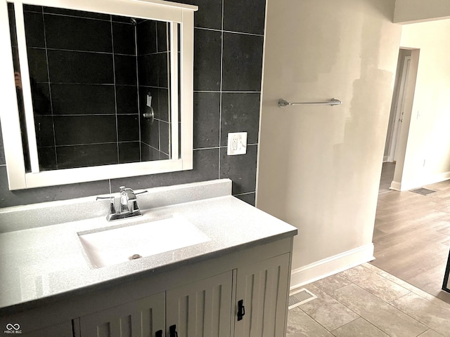 bathroom with wood-type flooring and vanity