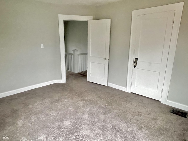 unfurnished bedroom featuring carpet