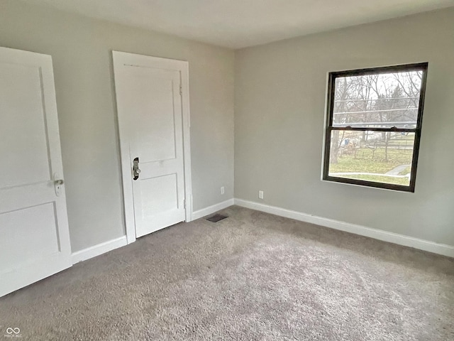 spare room featuring carpet floors