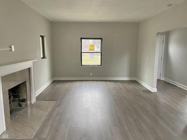 unfurnished living room with hardwood / wood-style flooring