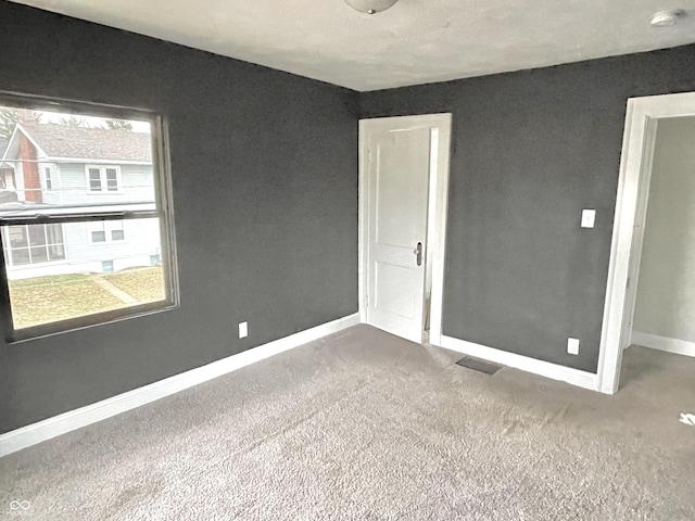 empty room with carpet floors