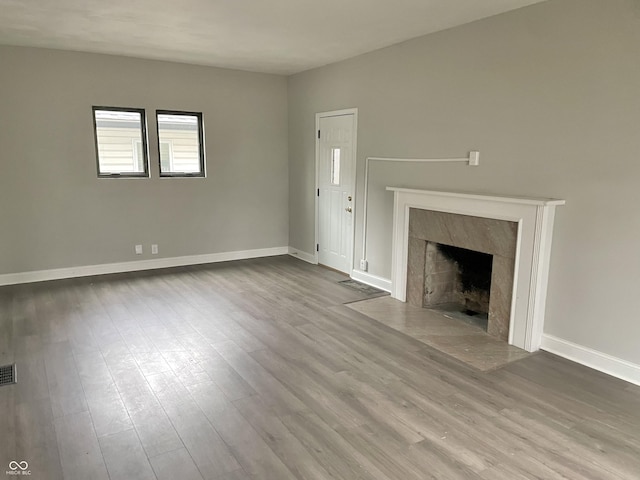 unfurnished living room with hardwood / wood-style floors