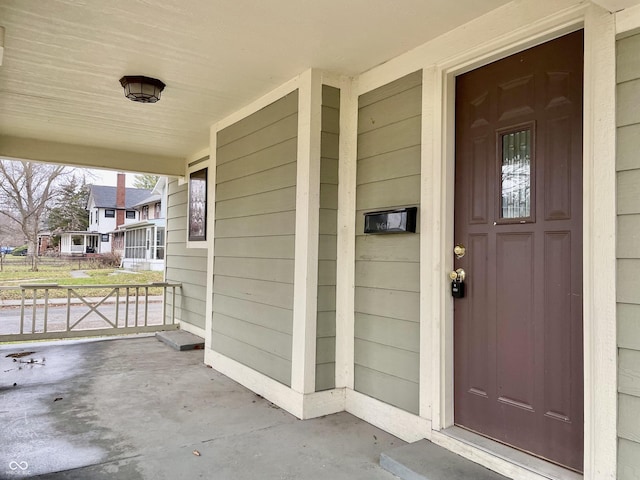 property entrance with covered porch