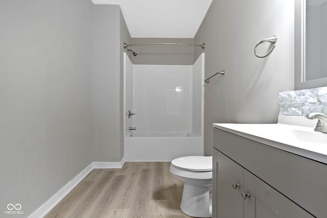 full bathroom with vanity,  shower combination, toilet, and wood-type flooring