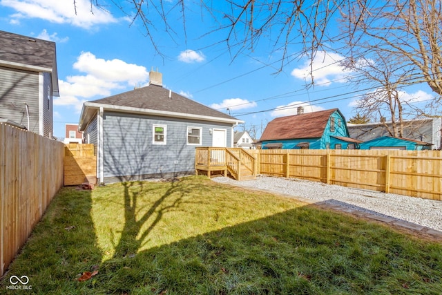 rear view of house featuring a lawn