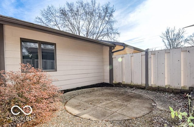 view of side of home with a patio area