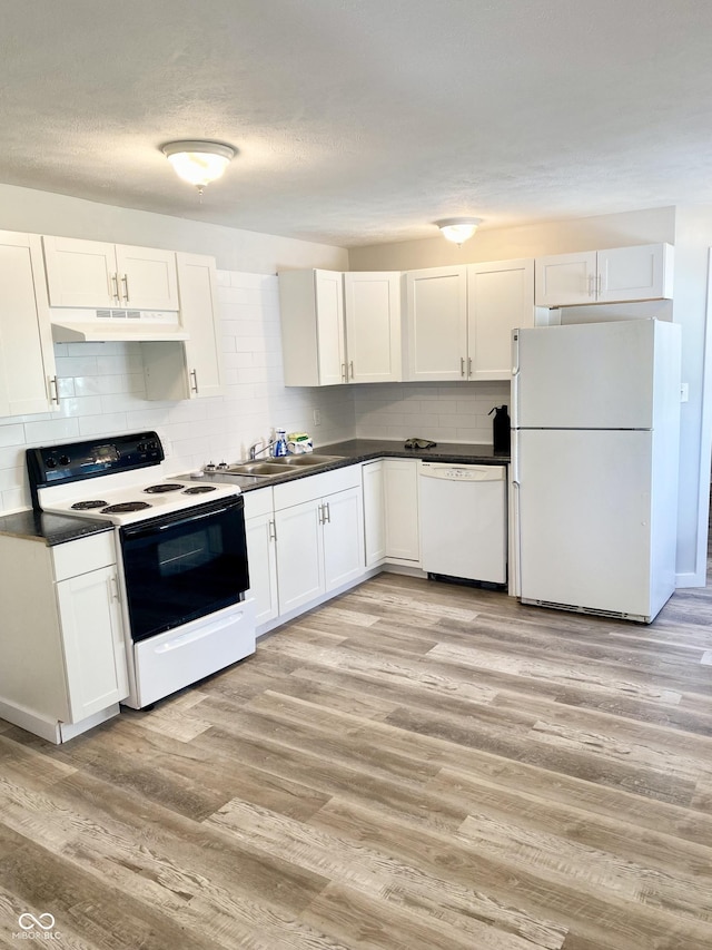 kitchen featuring white cabinets, white appliances, tasteful backsplash, and light hardwood / wood-style flooring