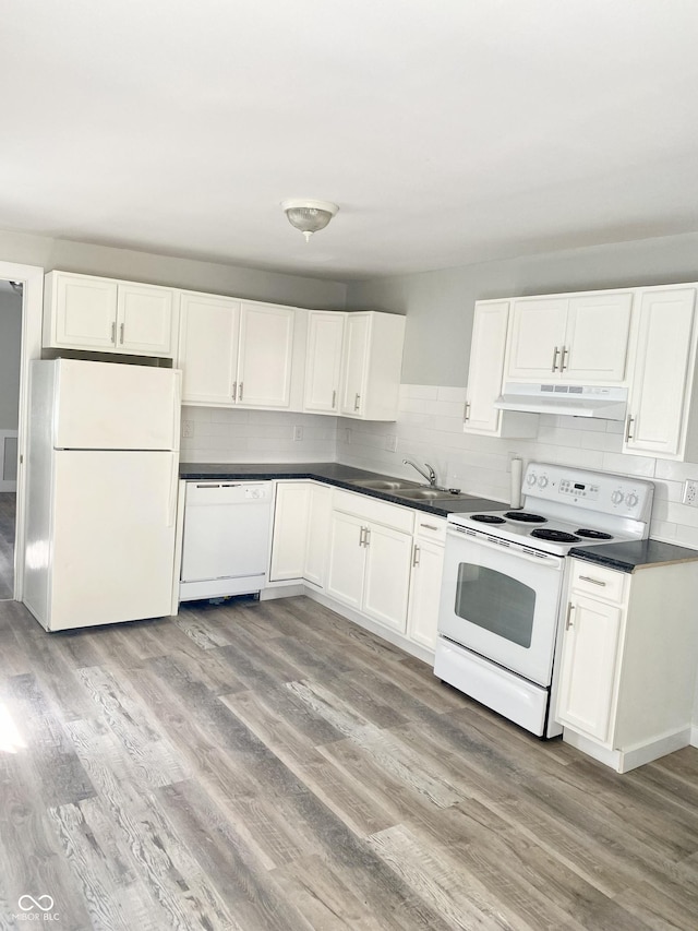 kitchen with sink, tasteful backsplash, light hardwood / wood-style floors, white appliances, and white cabinets