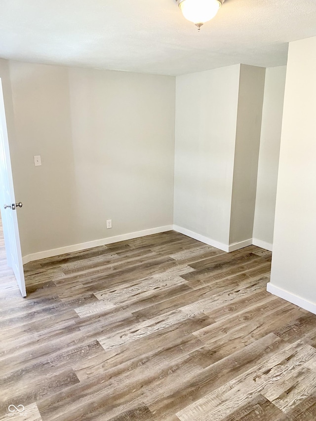 empty room featuring hardwood / wood-style flooring