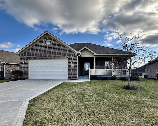 single story home featuring a porch, a garage, and a front lawn