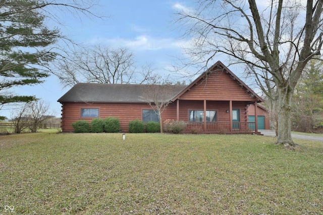 log-style house with a front lawn