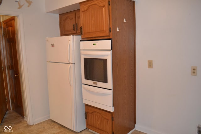 kitchen featuring white refrigerator