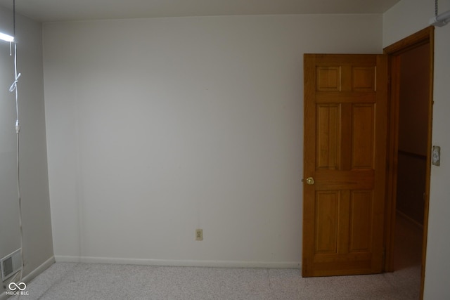 empty room with light colored carpet