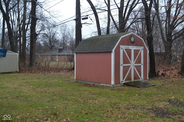 view of outbuilding featuring a yard