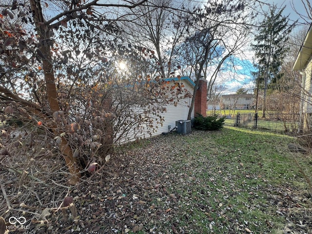 view of yard featuring central air condition unit